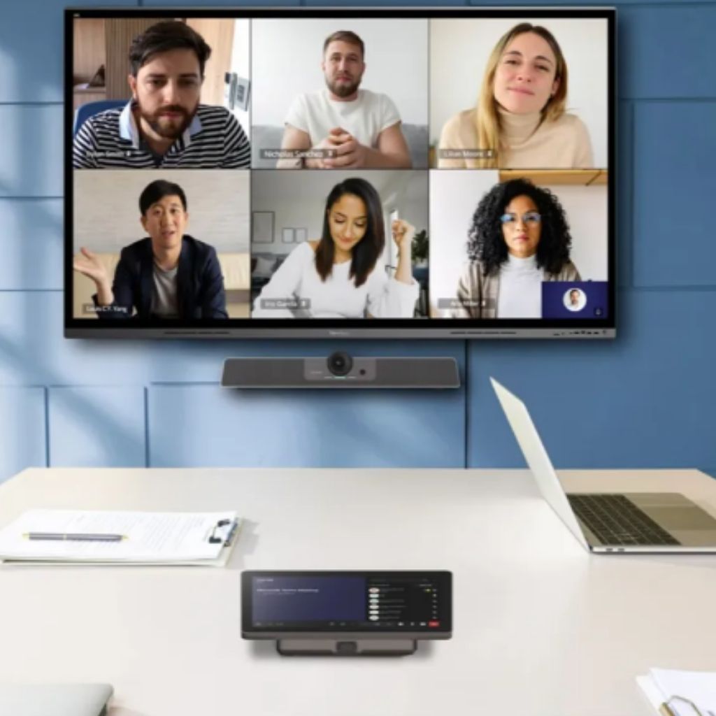 Viewsonic Meeting room technology; 6 colleagues on screen, 4 people in office; viewsonic interface on desk.